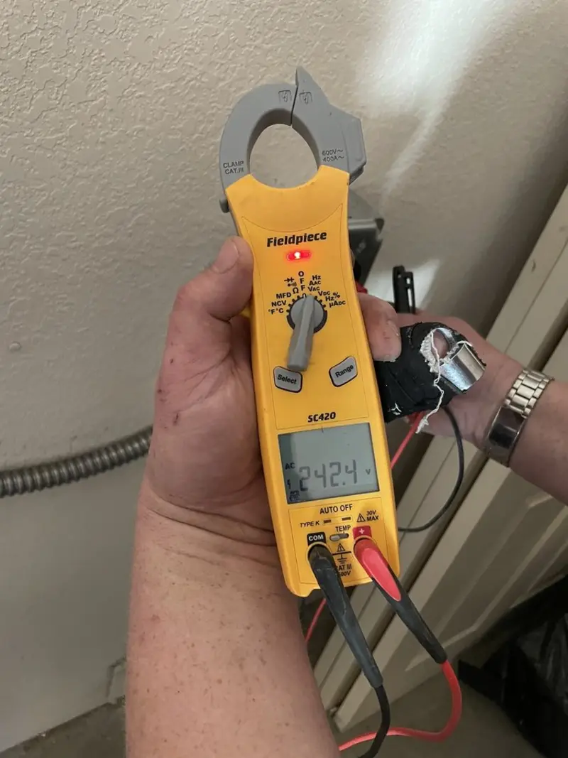 Voltage testing with clamp meter during Electrical Installation Services in Phoenix Lake